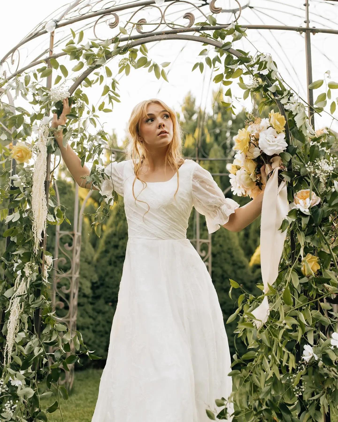 white rose bridal gown with flowers